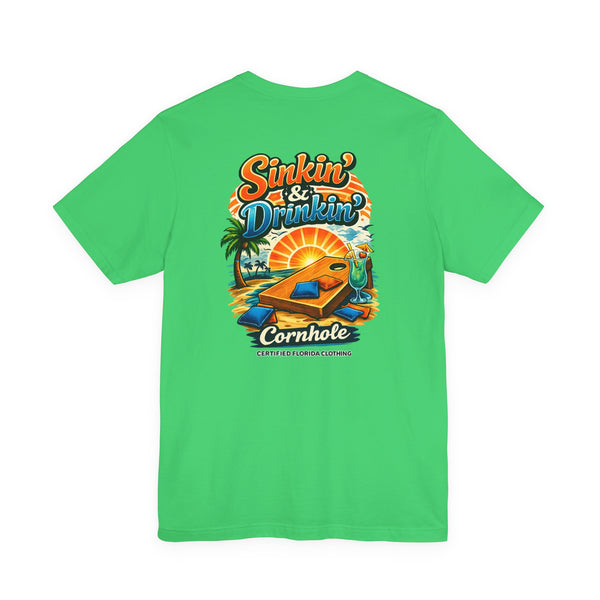 Cornhole T-Shirt — "Sinkin' & Drinkin'" Tropical Sunset Game Tee