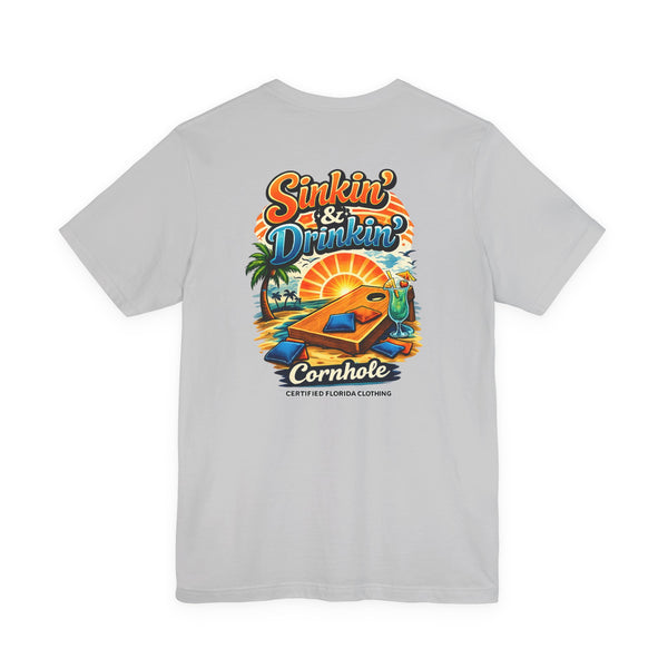 Cornhole T-Shirt — "Sinkin' & Drinkin'" Tropical Sunset Game Tee